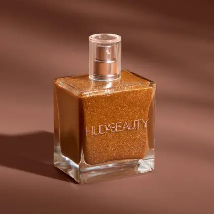 Get your glow on with Huda Beauty N.y.m.p.h. Body Drip Shimmering Dry Oil. This versatile face makeup and body oil is a must-have for luminous skin. Buy online at the best price in Bangladesh today! - Lavishta