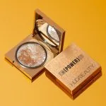 huda beauty empowered face gloss highlighting